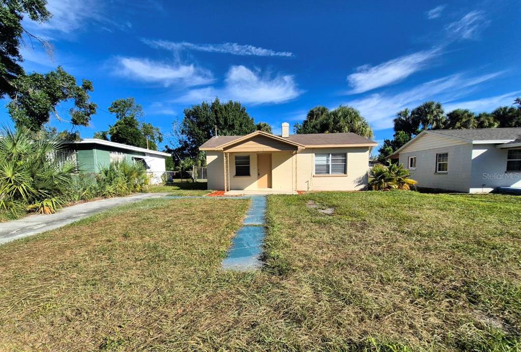 front view of a house with a yard