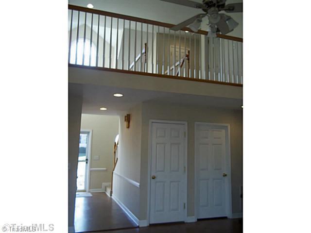 5248 Springhouse Farm Road Winston-Salem, NC 27107 - Photo 7 of 14 Living Room. View to Upper Level from Open LIving Room and Accessible to Finished Basement