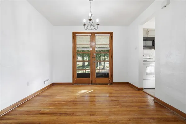 a view of a chandelier in an empty room