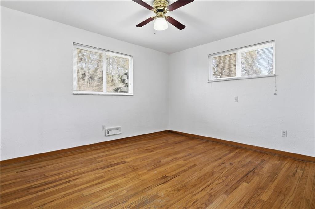 2055 Washington Road Pittsburgh, PA 15241 - Photo 14 of 31 a view of an empty room with wooden floor and a ceiling fan