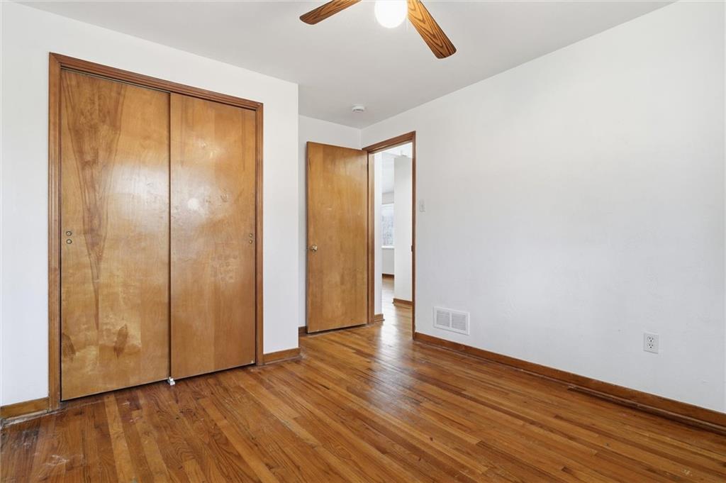2055 Washington Road Pittsburgh, PA 15241 - Photo 17 of 31 a view of an empty room with wooden floor and a window