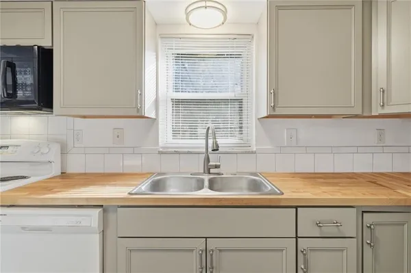 a kitchen with a sink and cabinets