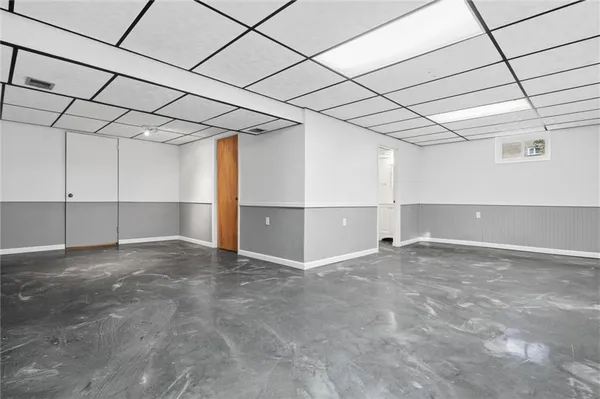 a bathroom with a toilet a sink and shower