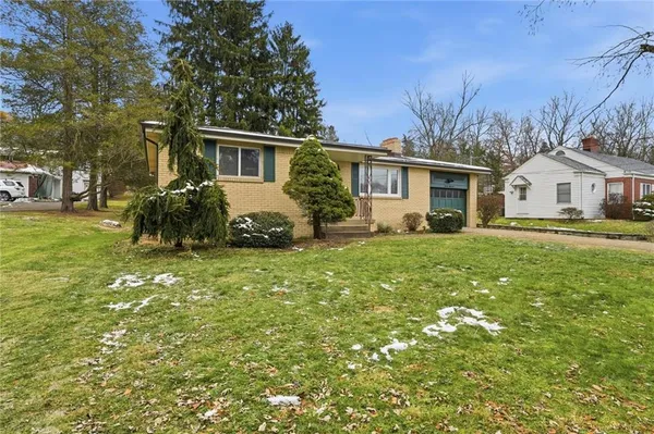 front view of a house with a yard