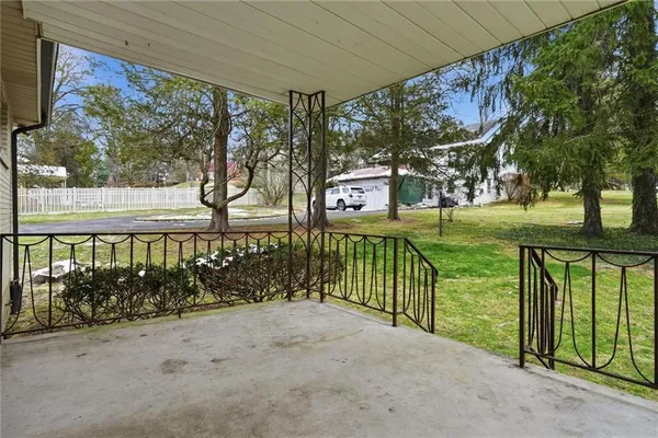 wooden floor fireplace and natural light in room