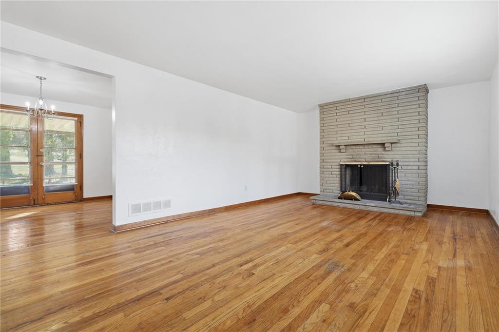 2055 Washington Road Pittsburgh, PA 15241 - Photo 6 of 31 wooden floor fireplace and natural light in room