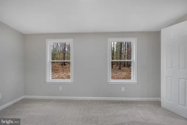 a bathroom with a bathtub shower sink vanity and toilet