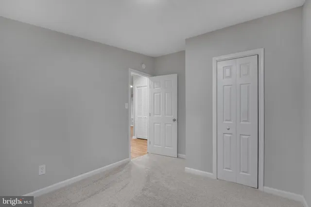 a bathroom with a bathtub sink vanity mirror and toilet