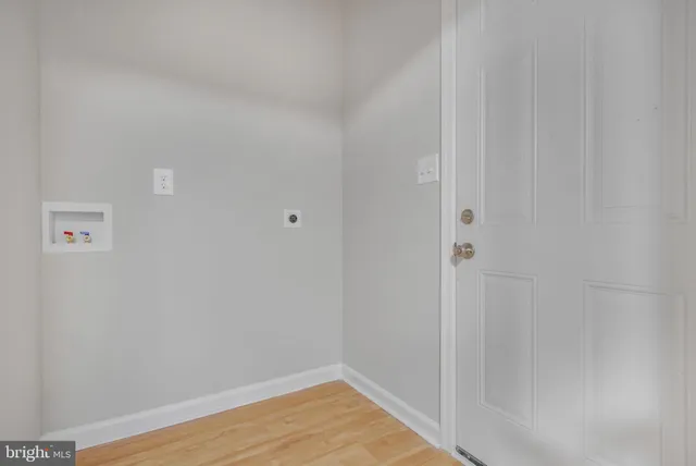 a view of deck with wooden floor and fence next to a yard