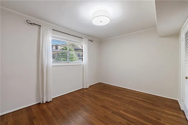 a kitchen with a sink a stove and cabinets