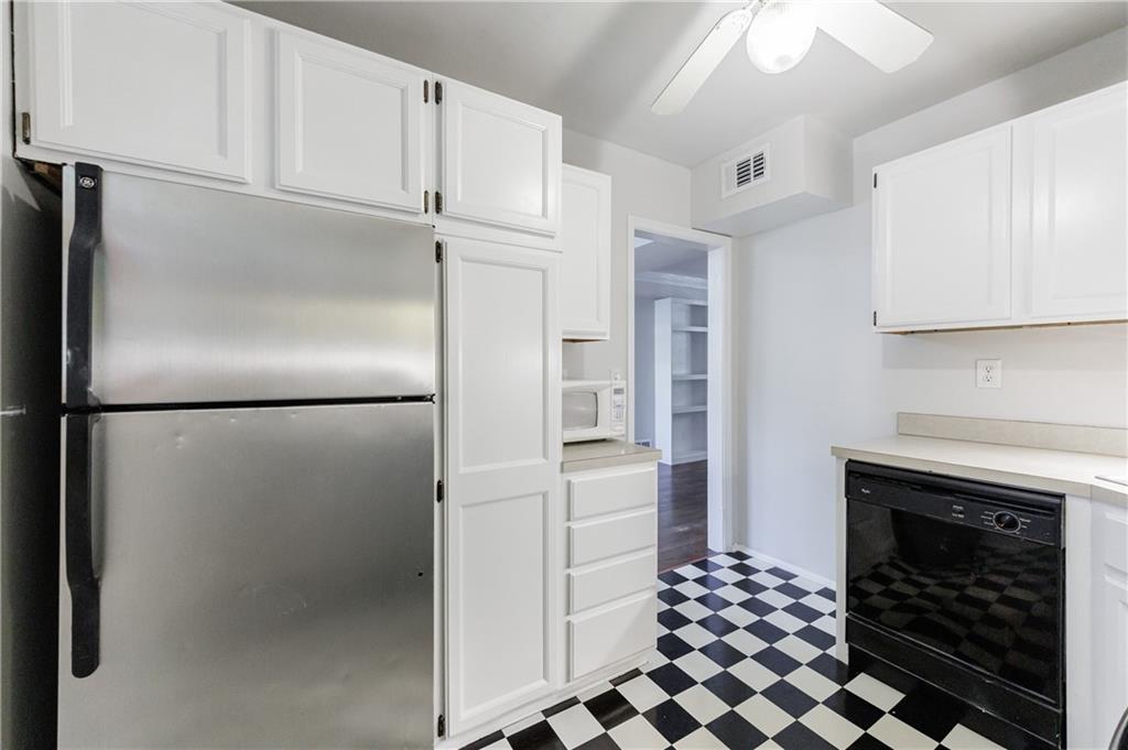 3660 Peachtree Road Northeast, Unit H2 Atlanta, GA 30319 - Photo 16 of 55 a kitchen with a refrigerator and a stove top oven