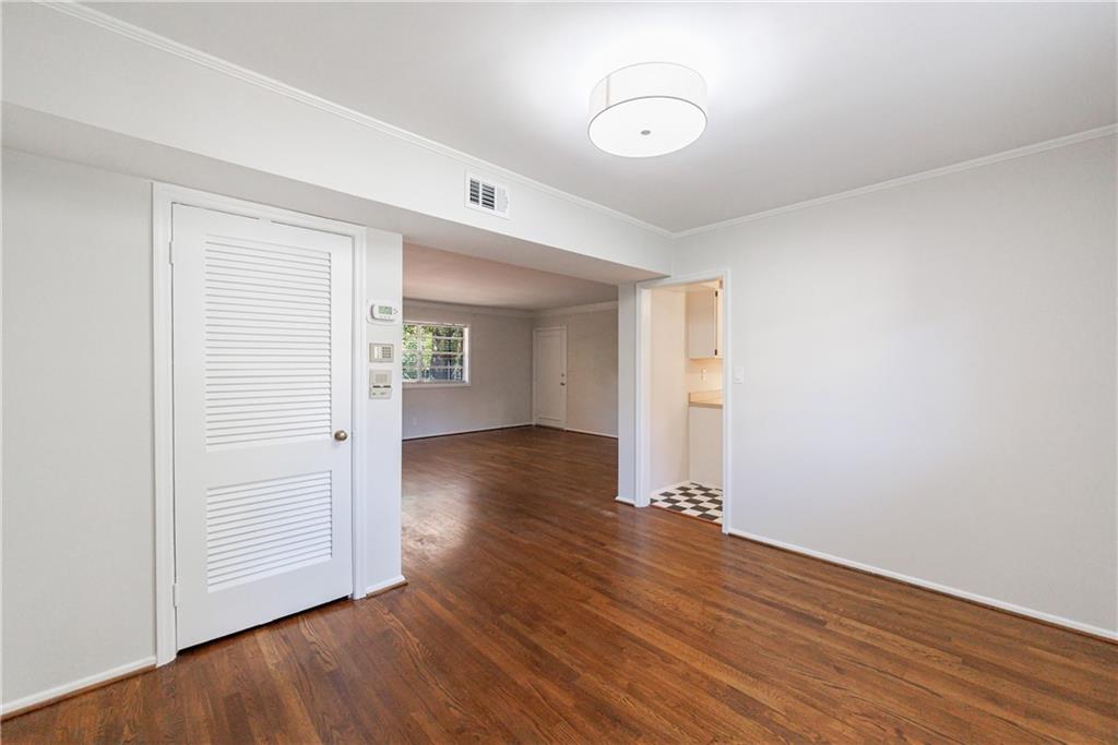 3660 Peachtree Road Northeast, Unit H2 Atlanta, GA 30319 - Photo 18 of 55 an empty room with wooden floor and windows