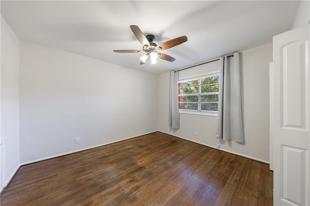 3660 Peachtree Road Northeast, Unit H2 Atlanta, GA 30319 - Photo 21 of 55 wooden floor in an empty room with a window