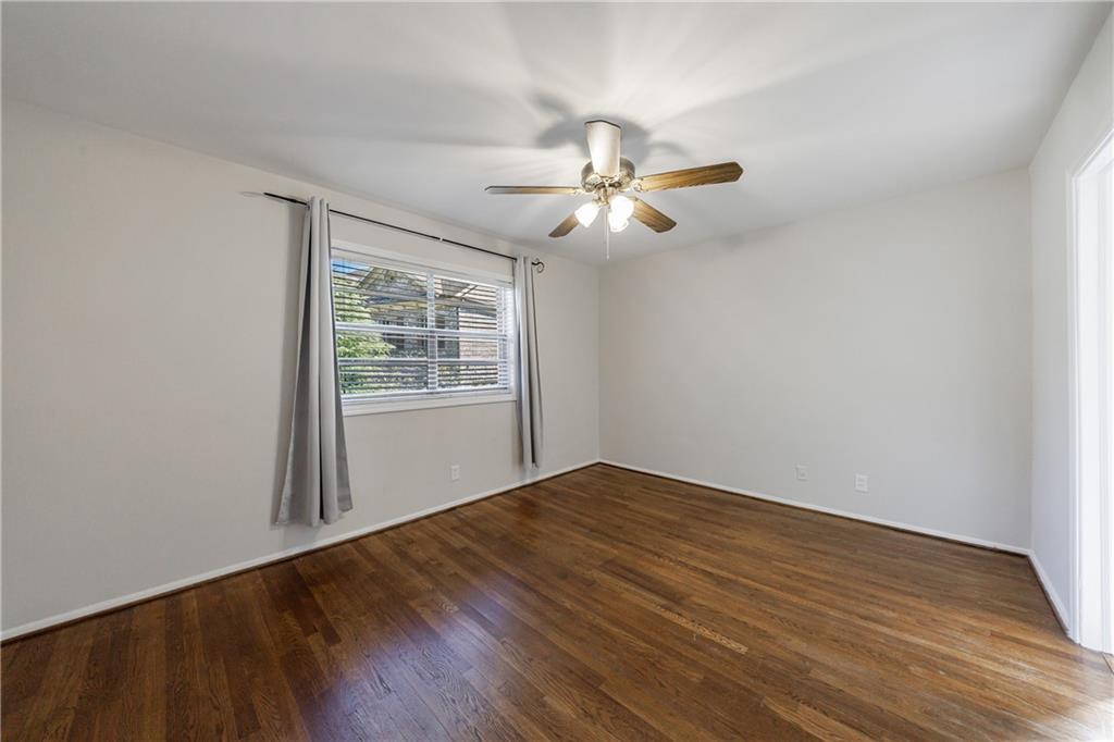 3660 Peachtree Road Northeast, Unit H2 Atlanta, GA 30319 - Photo 24 of 55 a view of empty room with wooden floor and fan