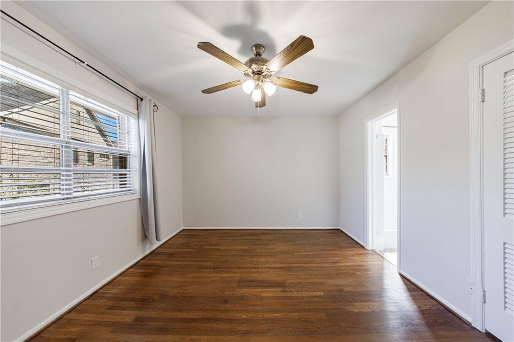 3660 Peachtree Road Northeast, Unit H2 Atlanta, GA 30319 - Photo 25 of 55 a view of empty room with wooden floor and fan
