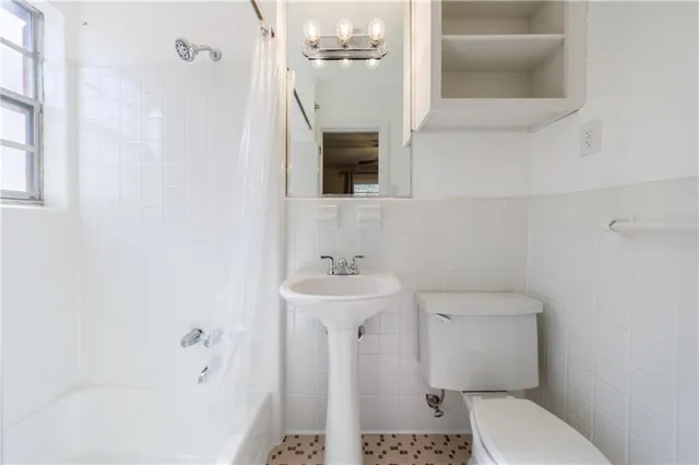 a view of a swimming pool with a lounge chair