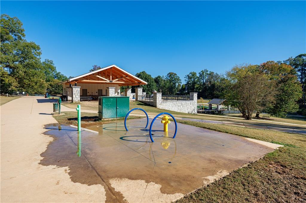 3660 Peachtree Road Northeast, Unit H2 Atlanta, GA 30319 - Photo 31 of 55 a view of a swimming pool with a lounge chair