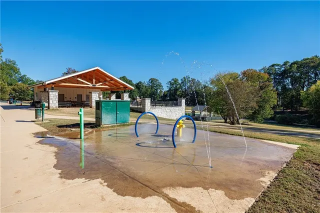 a view of a swimming pool with lounge chairs