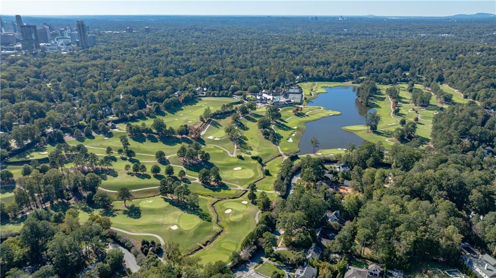 3660 Peachtree Road Northeast, Unit H2 Atlanta, GA 30319 - Photo 48 of 55 an aerial view of a house with a lake view