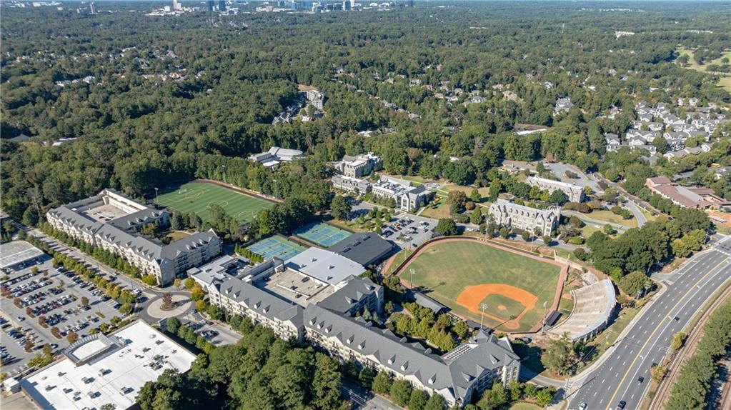 3660 Peachtree Road Northeast, Unit H2 Atlanta, GA 30319 - Photo 50 of 55 an aerial view of a house with a swimming pool and lake view