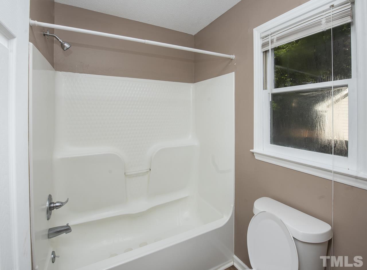 4217 Timberbrook Drive Raleigh, NC 27616 - Photo 22 of 23 a bathroom with a toilet and a shower