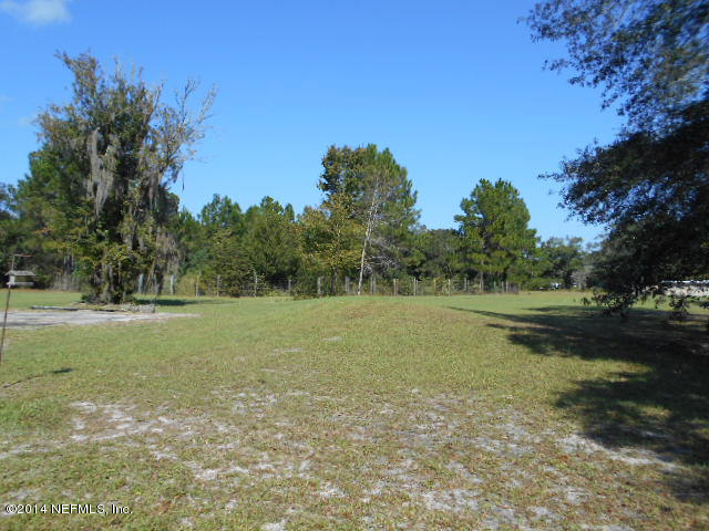 365 Kirk Road Jacksonville, FL 32218 - Photo 23 of 32 21 pond is beyond brush line