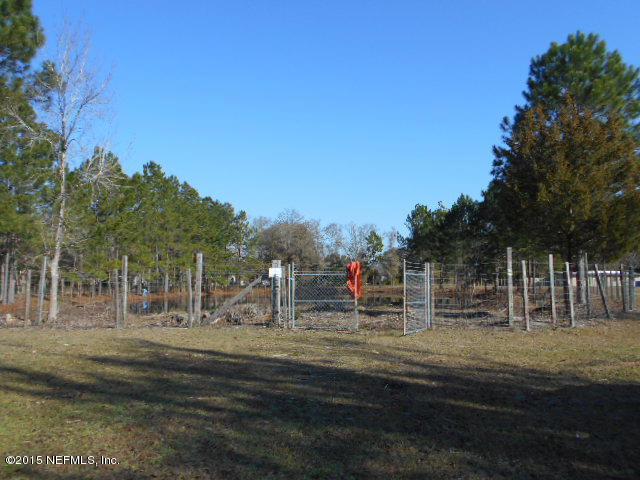 365 Kirk Road Jacksonville, FL 32218 - Photo 25 of 32 22 brush around the pond is cleared