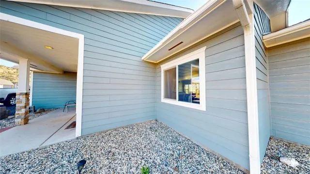 a view of a room with furniture and wooden floor