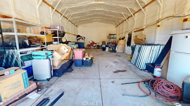 a kitchen with granite countertop a sink and cabinets