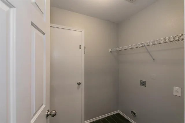 a view of a room with racks on the wall