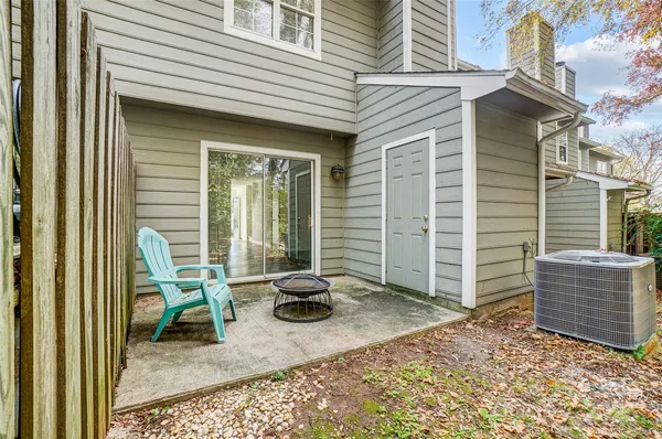 a view of a chair and table in the house