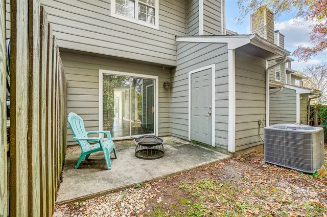 a view of a chair and table in the house