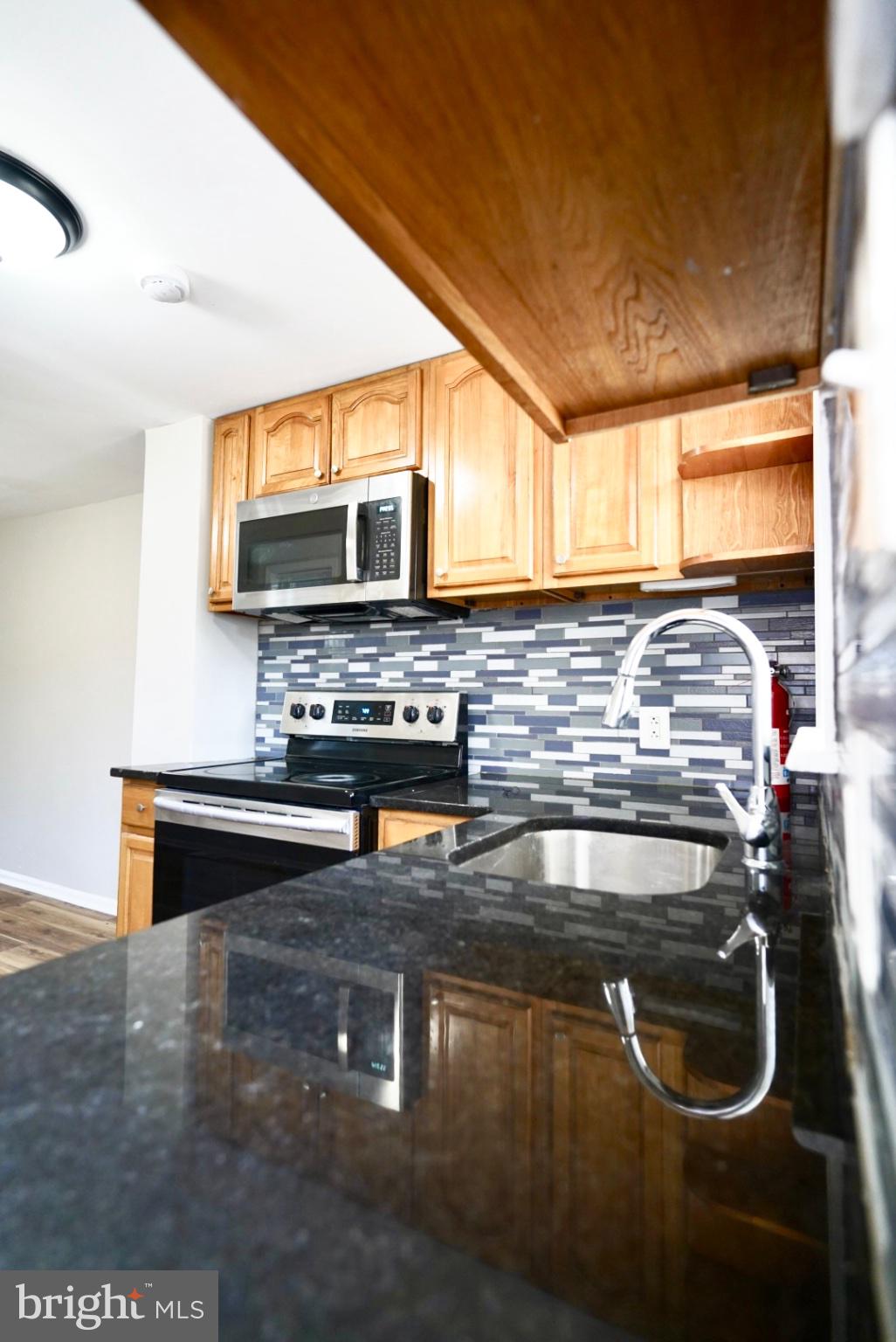 2655 Cedar Street Philadelphia, PA 19125 - Photo 11 of 22 a kitchen with a sink and a stove