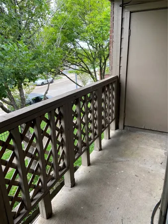 a view of a street view from a balcony
