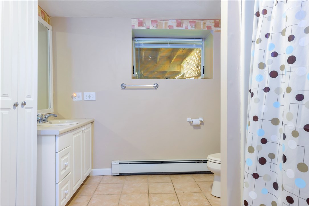 17 Beach Plum Road Narragansett, RI 02882 - Photo 16 of 20 Full bathroom with tub and shower on the lower level.
