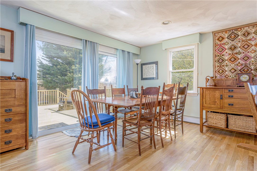17 Beach Plum Road Narragansett, RI 02882 - Photo 4 of 20 Dining area with large sliding door out to the deck and the rear yard.