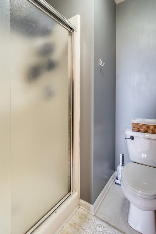 392 Cedar Grove Road Lebanon, TN 37087 - Photo 15 of 28 a white toilet sitting next to a shower