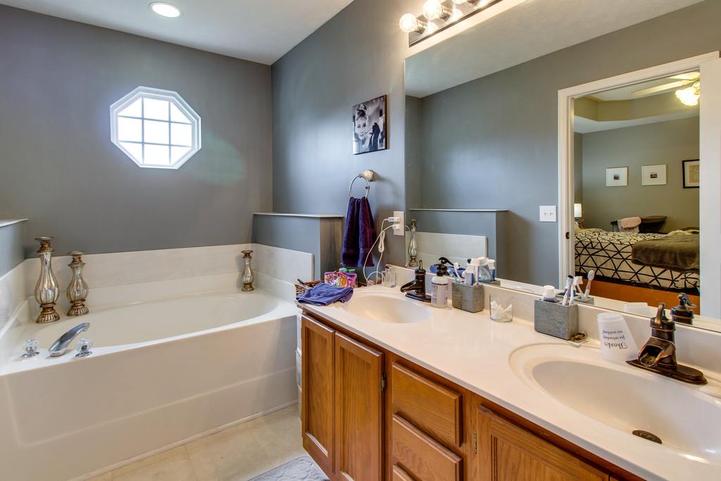 392 Cedar Grove Road Lebanon, TN 37087 - Photo 16 of 28 a bathroom with a double vanity sink mirror and bathtub