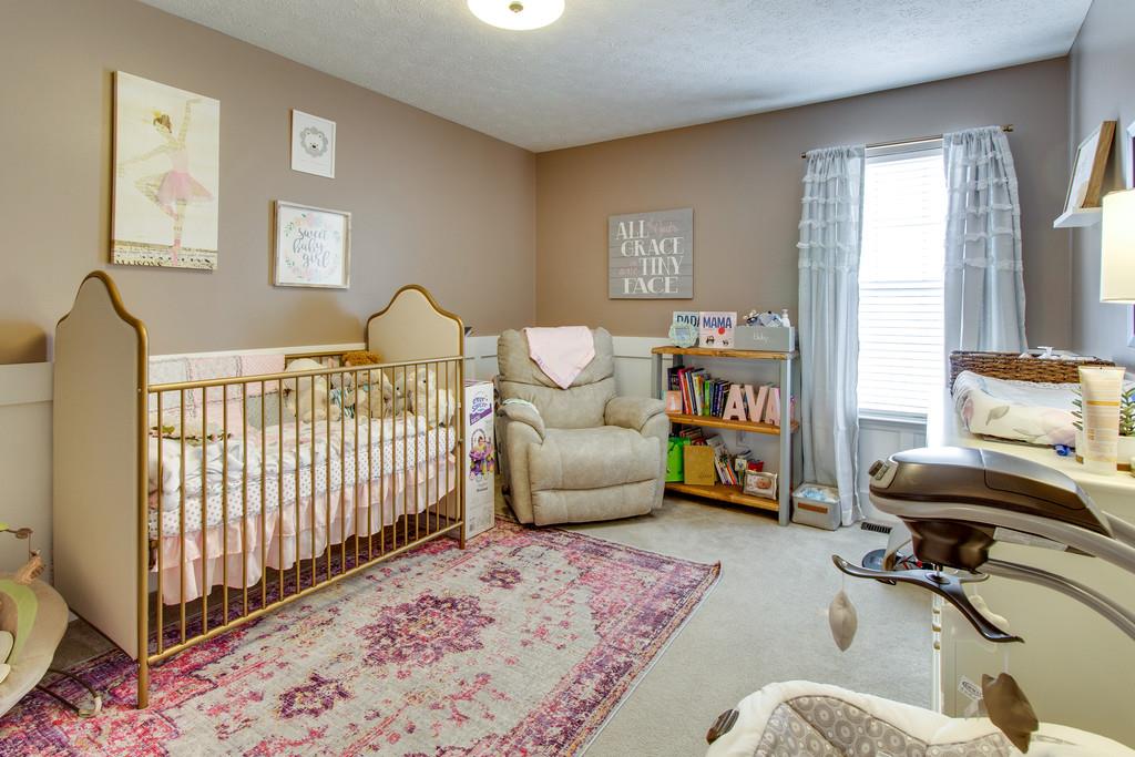 392 Cedar Grove Road Lebanon, TN 37087 - Photo 19 of 28 a bedroom with furniture and a book shelf