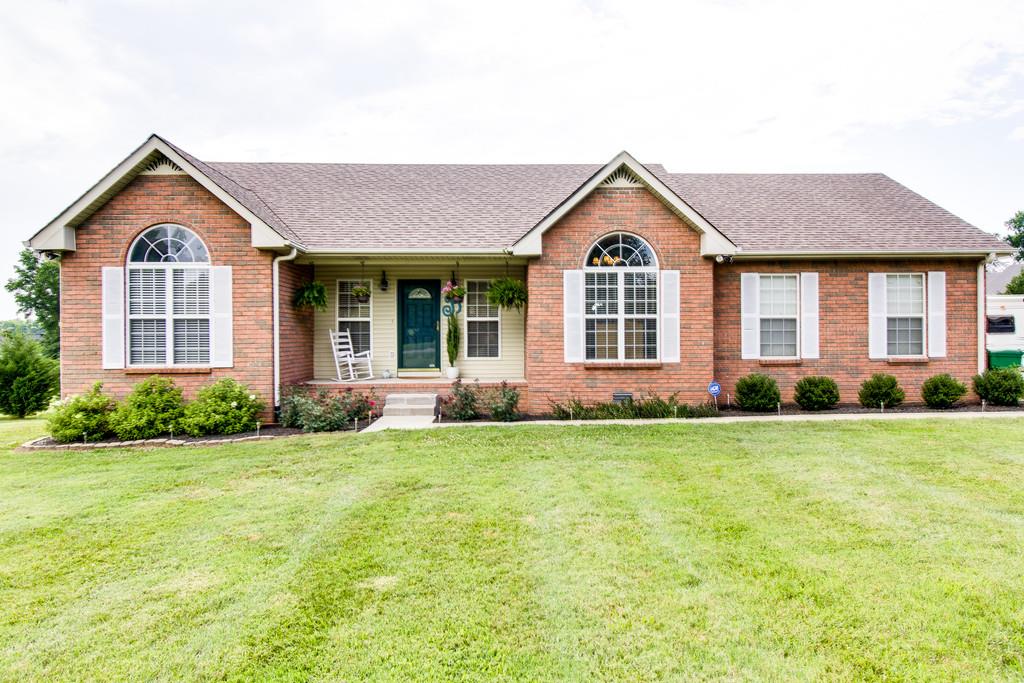 392 Cedar Grove Road Lebanon, TN 37087 - Photo 2 of 28 a front view of a house with a yard and garage