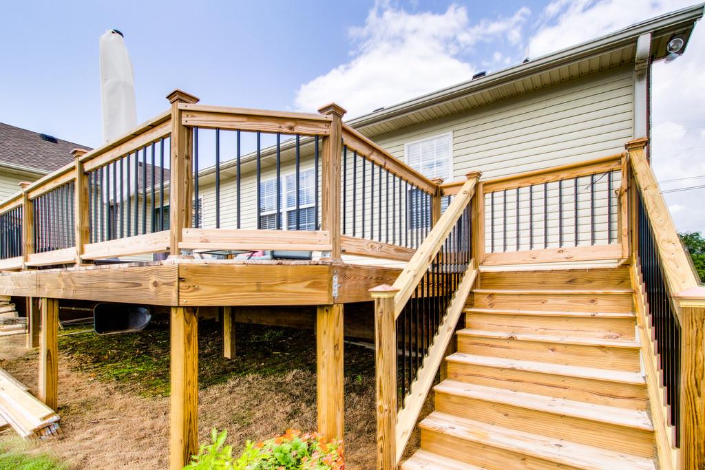 392 Cedar Grove Road Lebanon, TN 37087 - Photo 26 of 28 a view of a balcony with chair and wooden floor