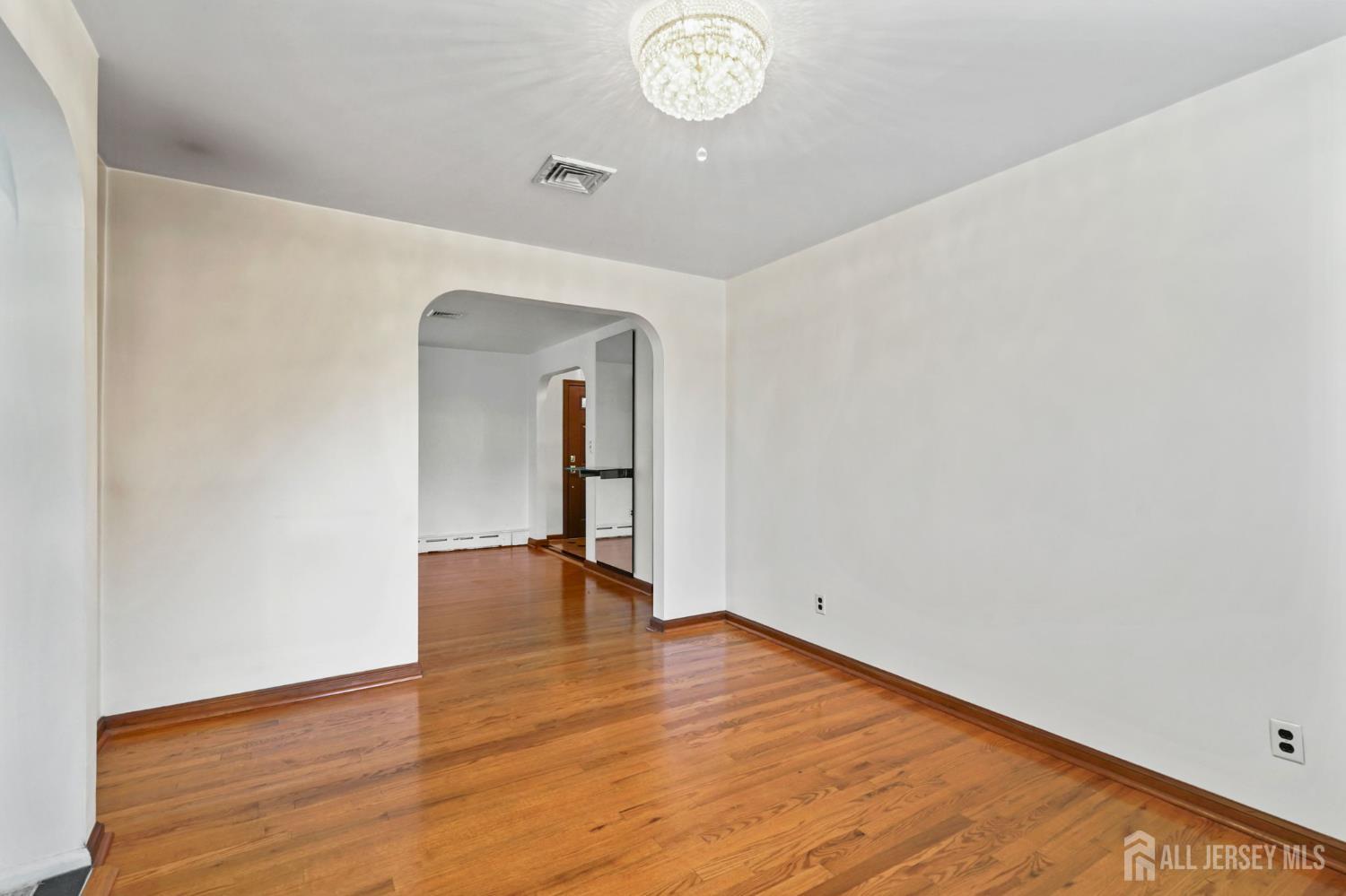 21 Reed Street Edison, NJ 08817 - Photo 15 of 27 a view of empty room with wooden floor