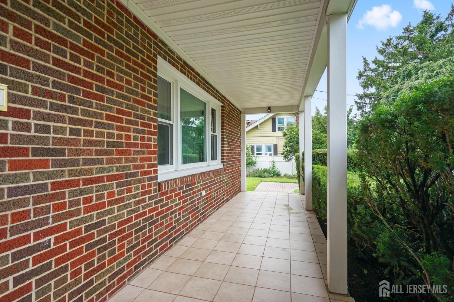 21 Reed Street Edison, NJ 08817 - Photo 4 of 27 a view of a pathway both side of house