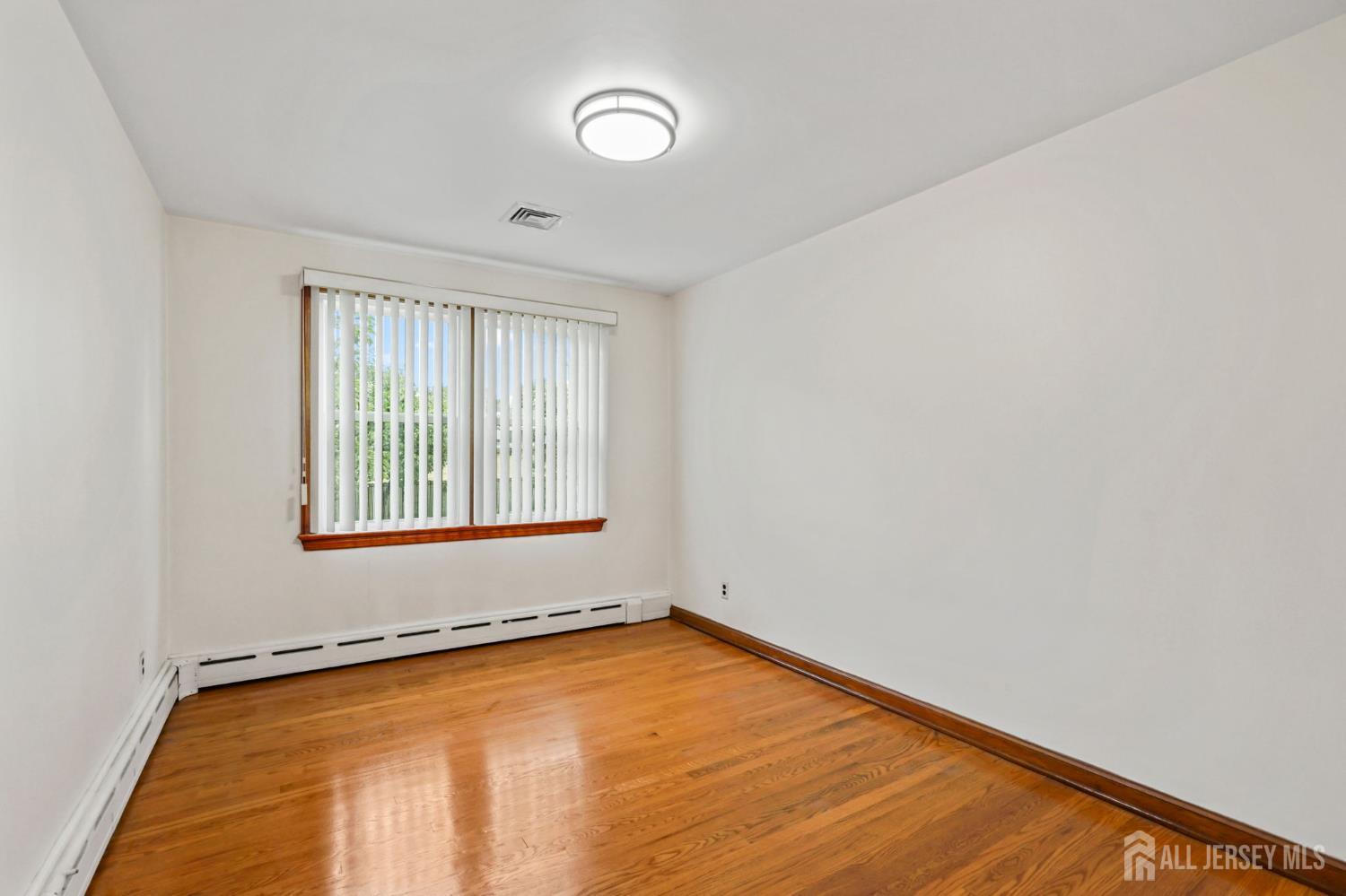21 Reed Street Edison, NJ 08817 - Photo 7 of 27 an empty room with a window
