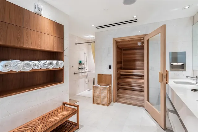 a kitchen with granite countertop a refrigerator and a stove