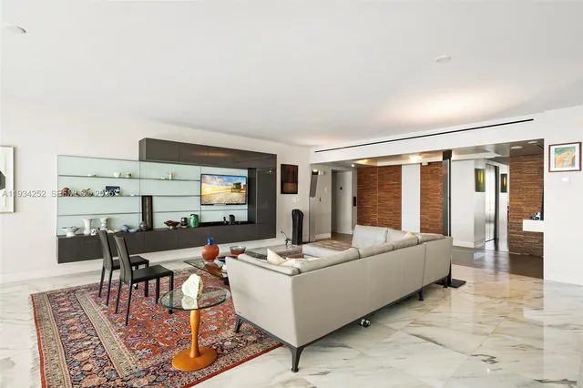 a living room with furniture and large window