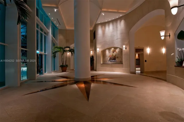 a view of a lobby with black carpet