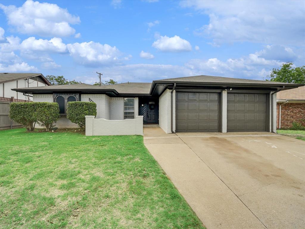 3937 Windhaven Road Fort Worth, TX 76133 - Photo 1 of 1 a front view of a house with garden