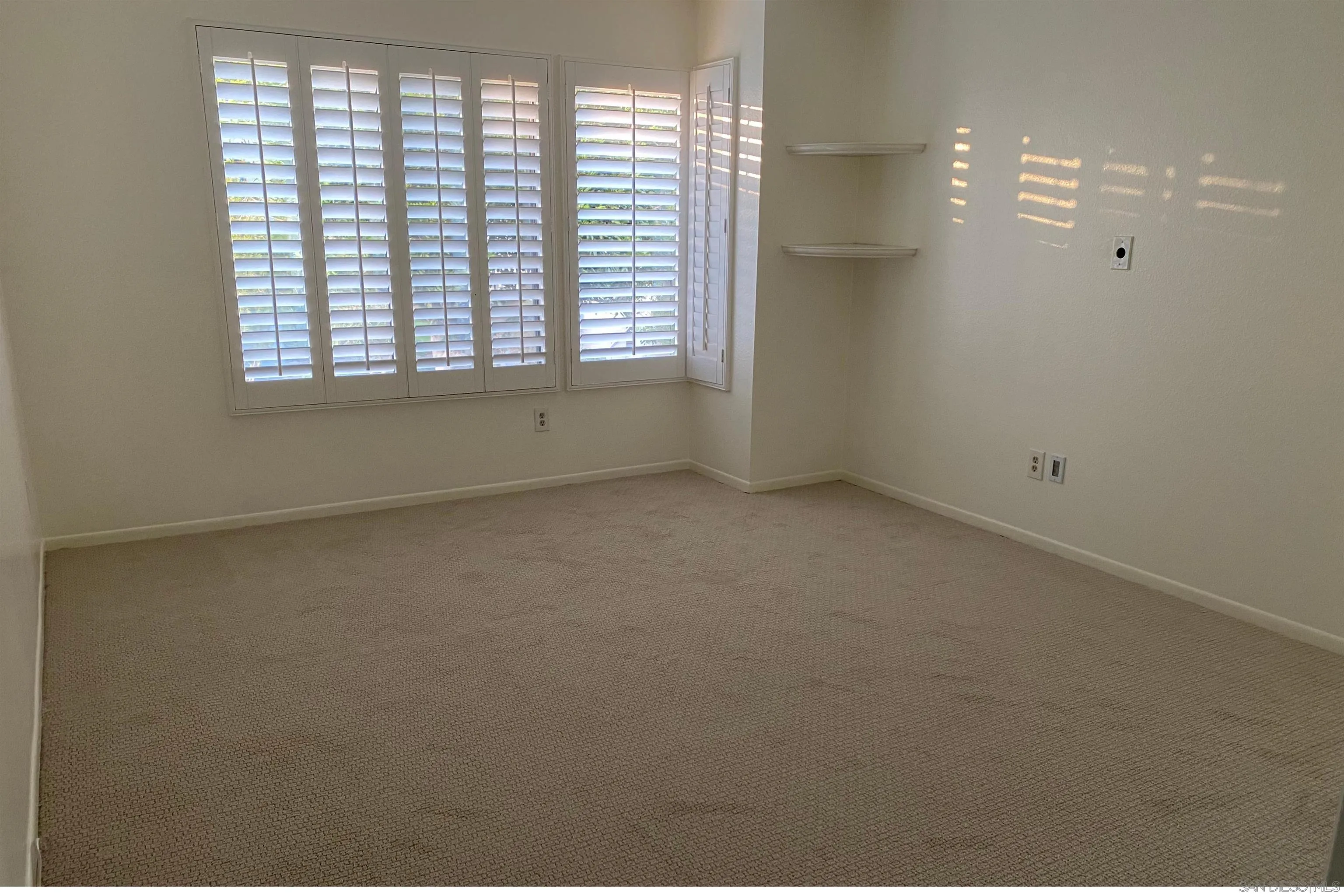 928 Intrepid Court Del Mar, CA 92014 - Photo 13 of 27 an empty room with windows