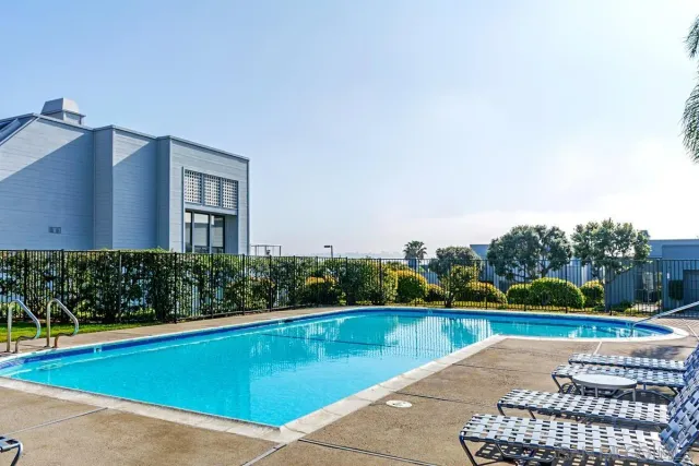 a view of swimming pool with a yard